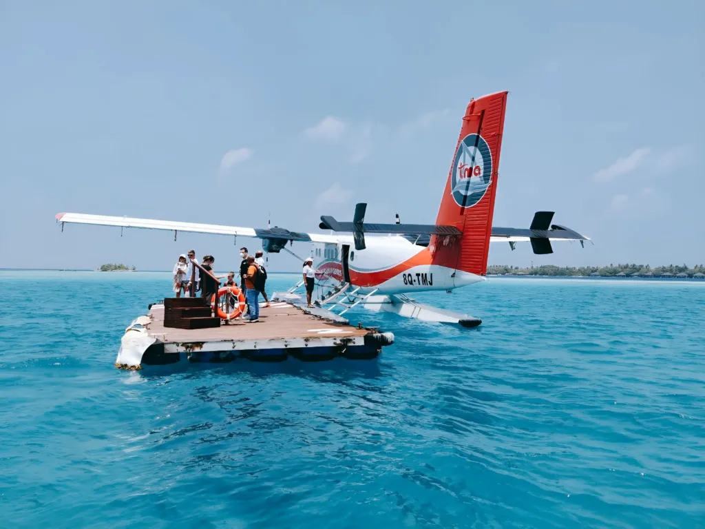 Trans Maldivian Airways flight at platform